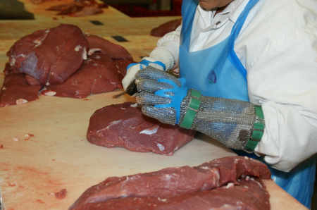 butcher-meat butcher cutting meat