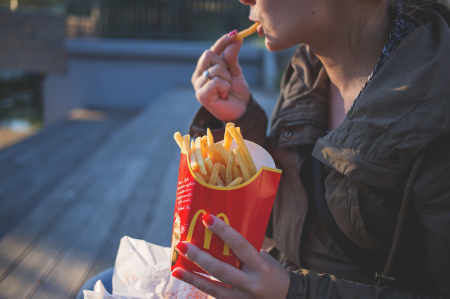 french-fries-woman Woman eating McDonald's french fries